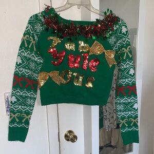 Chic Off-the-Shoulder Green Sweater with Festive Accents